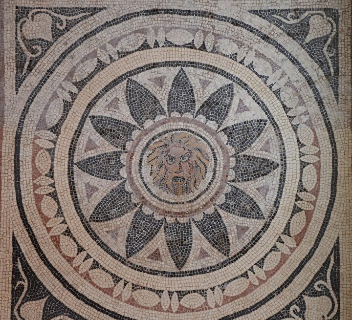 899px-4th_century_AD_Mosaic_with_mask_of_Phobos_(Fear)_within_a_radiating_petal_design,_from_Halicanassus_(Asia_Minor),_British_Museum_(14256569991)